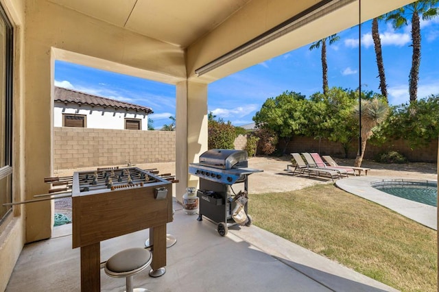 view of patio with an outdoor fire pit, a grill, and a fenced in pool