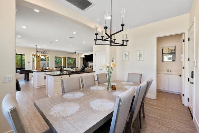 dining area featuring light wood-type flooring, ceiling fan, pool table, and sink