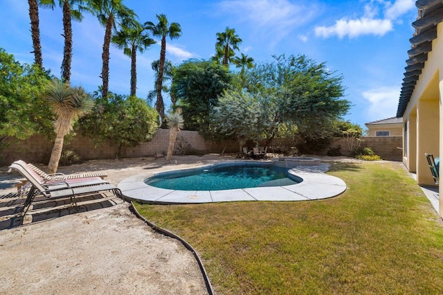 view of swimming pool featuring a patio area, an in ground hot tub, and a lawn