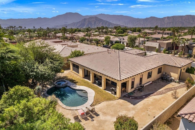 birds eye view of property with a mountain view