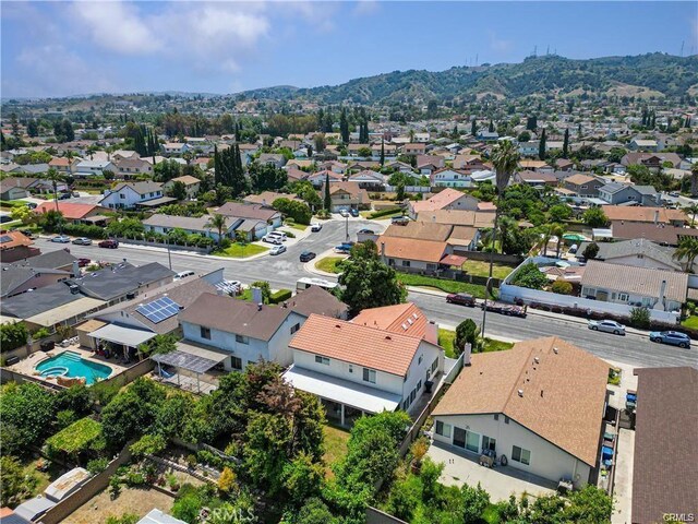 drone / aerial view featuring a mountain view