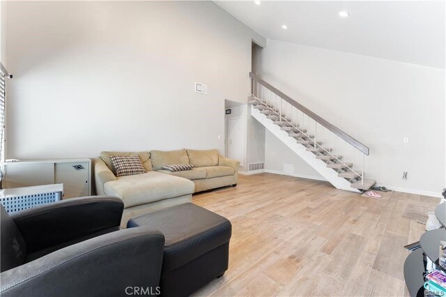 living room with light hardwood / wood-style flooring