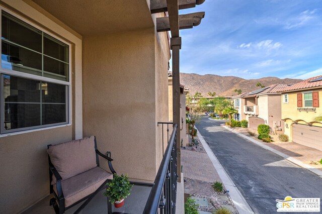 balcony featuring a mountain view