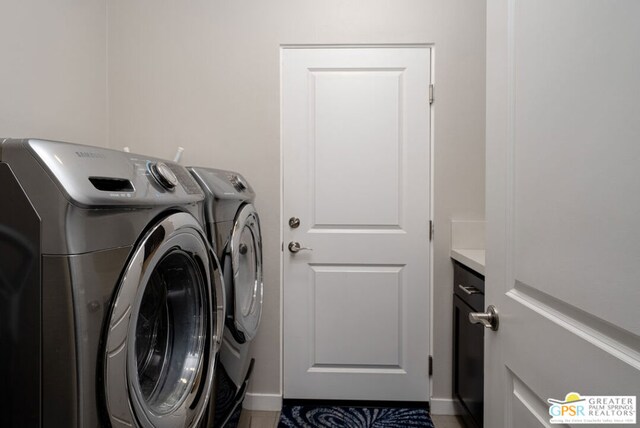 washroom with washing machine and dryer