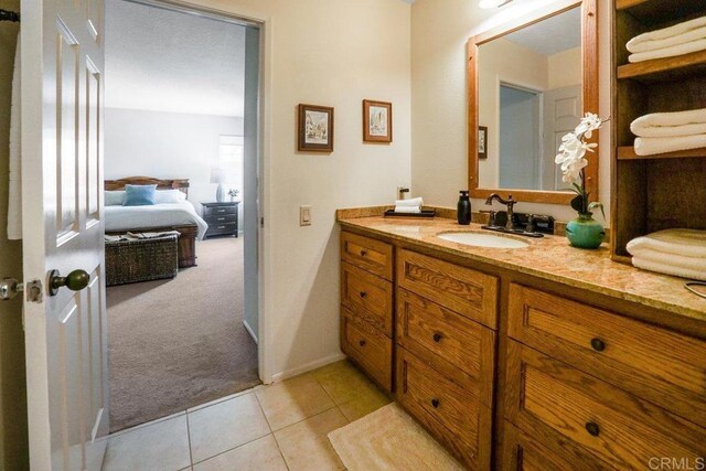 bathroom featuring tile patterned flooring and vanity