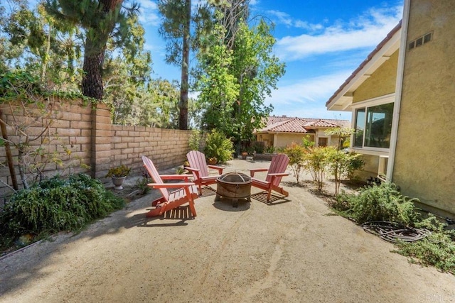 view of patio featuring an outdoor fire pit