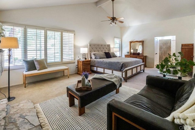 bedroom with ceiling fan, light colored carpet, and vaulted ceiling with beams