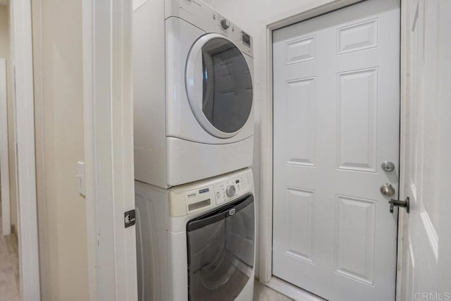 laundry room featuring stacked washer / dryer