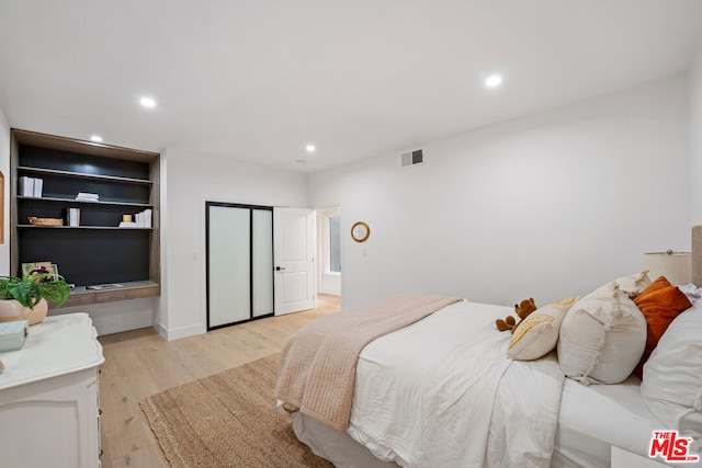 bedroom featuring light hardwood / wood-style floors