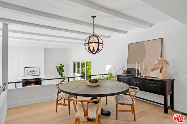 dining space featuring beamed ceiling, light hardwood / wood-style flooring, and a notable chandelier