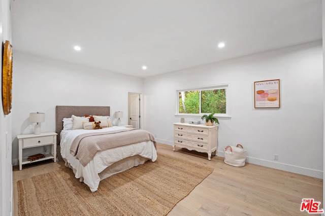 bedroom with light hardwood / wood-style flooring