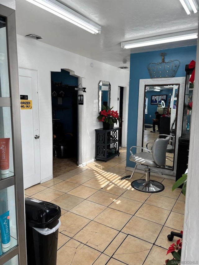 hallway featuring tile patterned floors