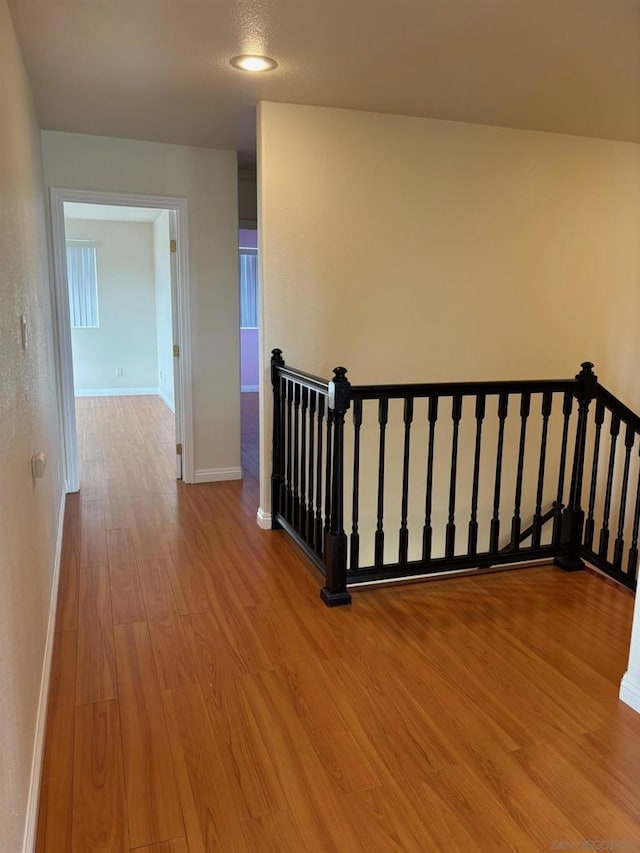 stairs with hardwood / wood-style flooring