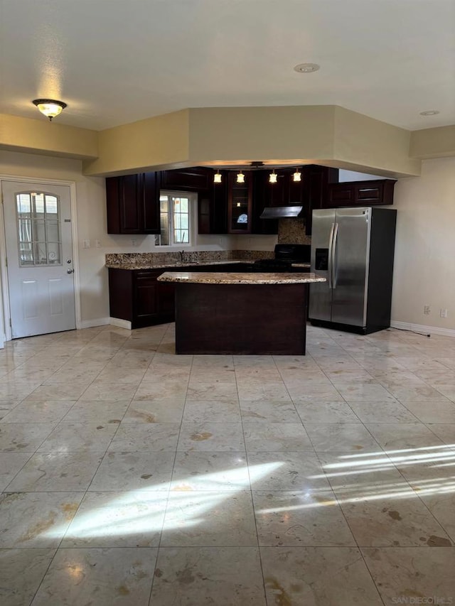 kitchen featuring black electric range, stainless steel fridge with ice dispenser, and dark brown cabinetry