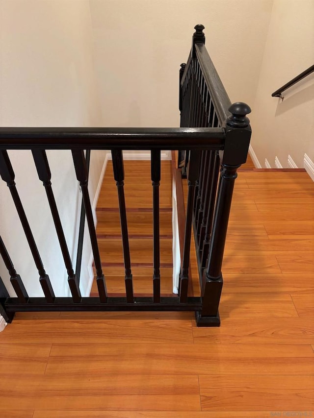 staircase featuring hardwood / wood-style flooring