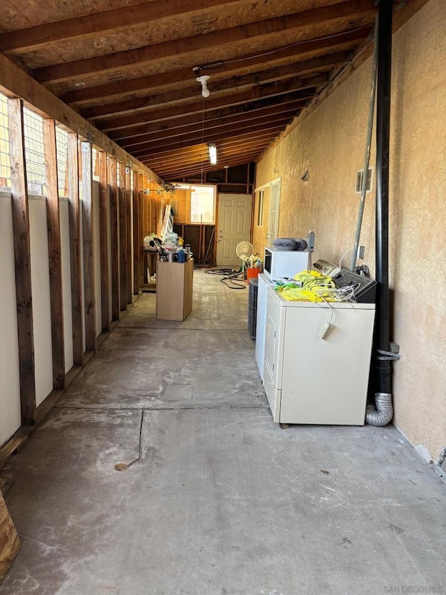 basement featuring washing machine and dryer and a wealth of natural light