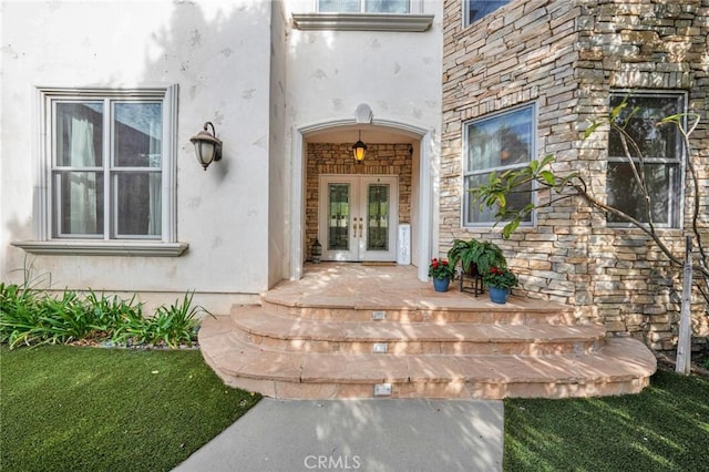 entrance to property featuring french doors