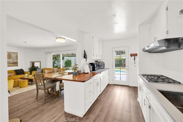 kitchen featuring white cabinetry and a healthy amount of sunlight