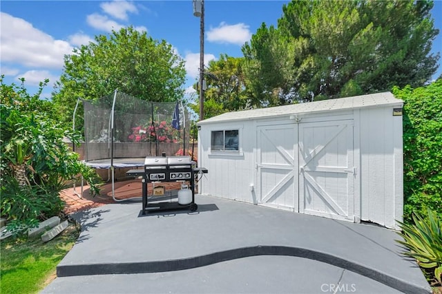 view of outbuilding with a trampoline