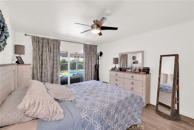 bedroom with ceiling fan, access to exterior, and light wood-type flooring