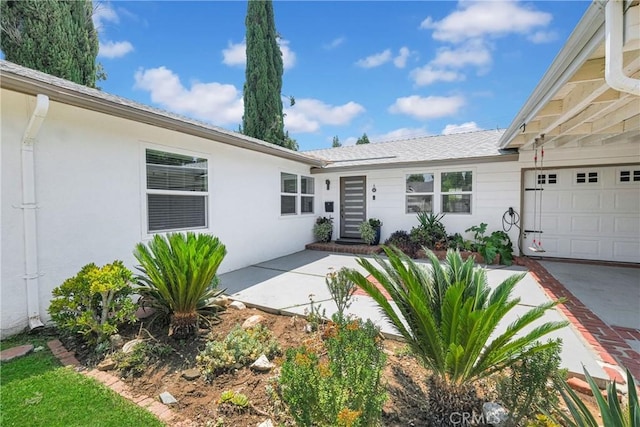 property entrance with a garage