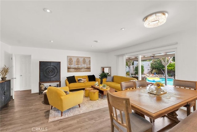 dining space with hardwood / wood-style flooring