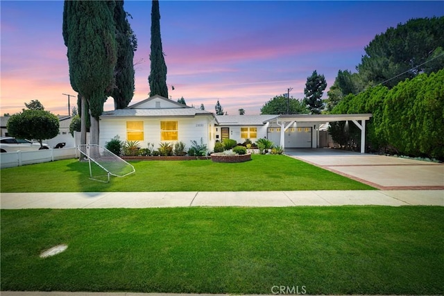 ranch-style house with a carport and a yard