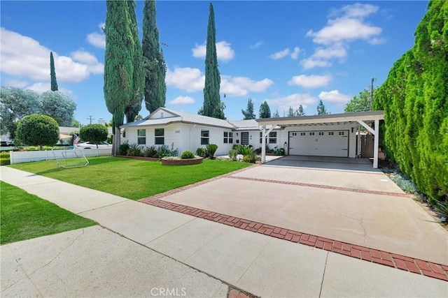 ranch-style house with a garage, a front lawn, and a carport