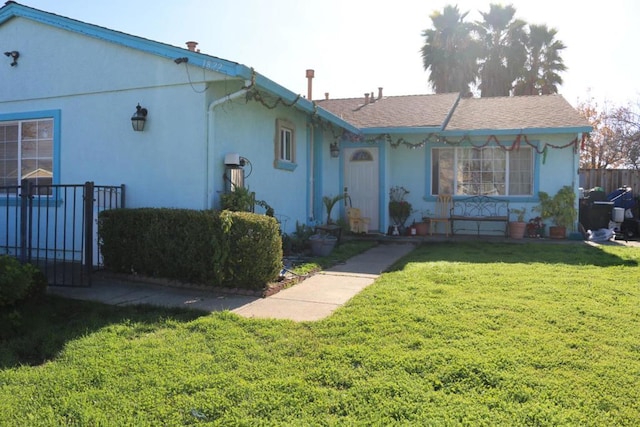 view of front of property with a front lawn