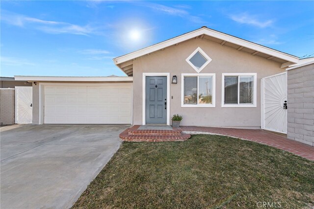 single story home with a front lawn and a garage