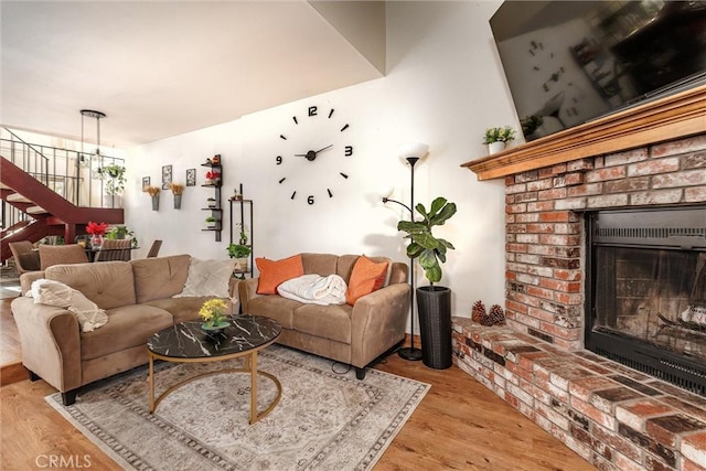 living room with a fireplace and light hardwood / wood-style floors