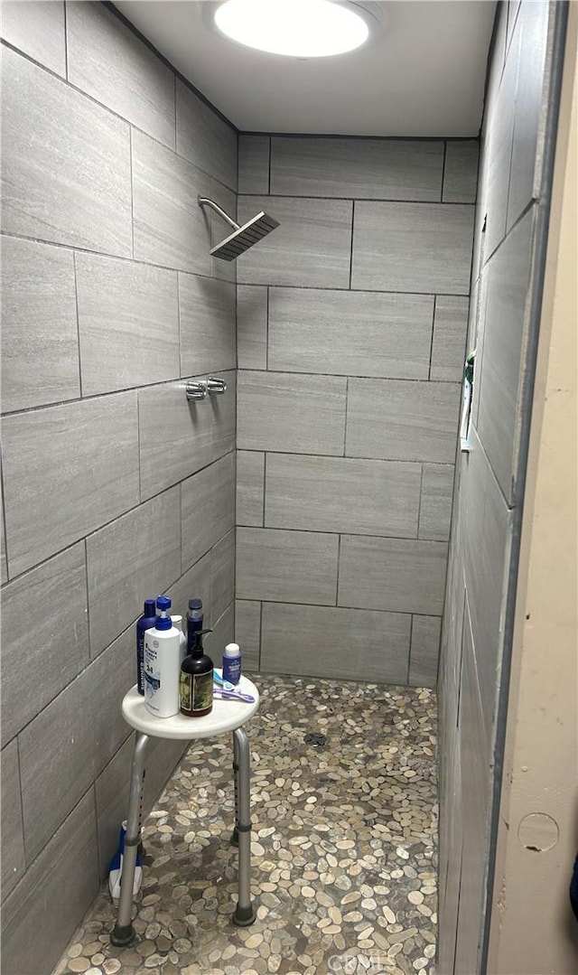 bathroom with tiled shower