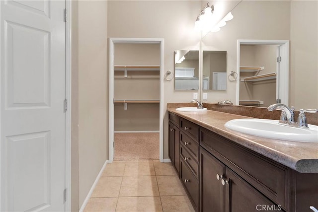 bathroom with tile patterned floors and vanity