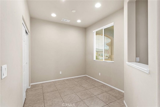 unfurnished room with light tile patterned floors