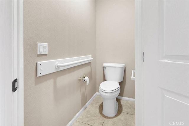 bathroom with tile patterned floors and toilet