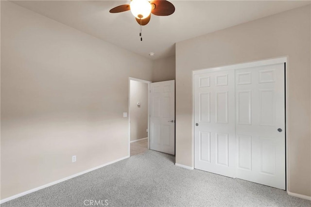 unfurnished bedroom with light carpet, ceiling fan, and a closet