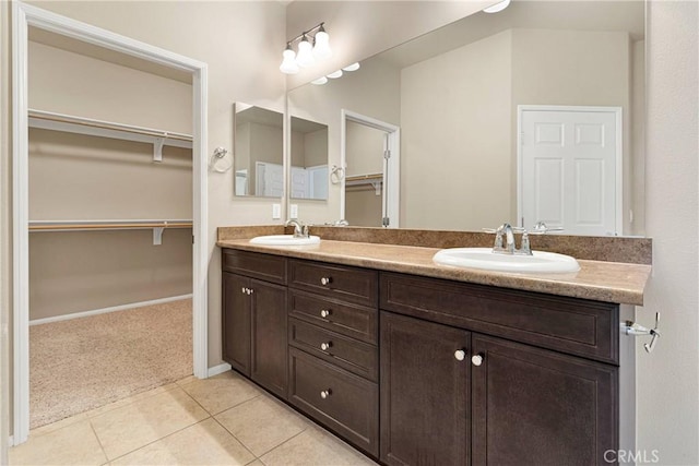 bathroom with tile patterned floors and vanity