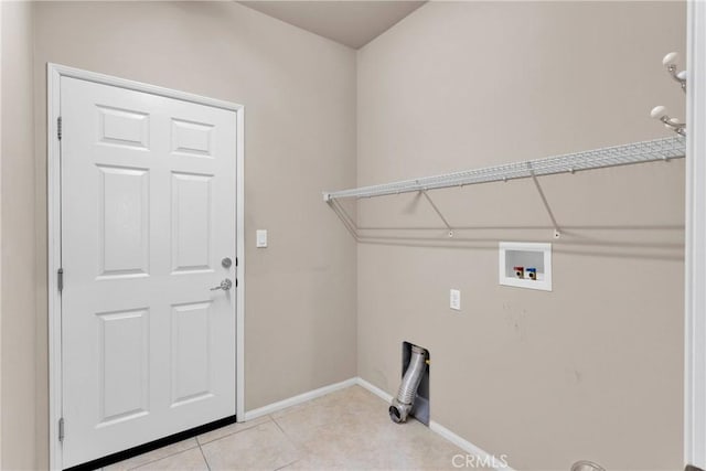 laundry room featuring washer hookup and light tile patterned floors