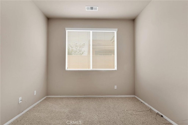 carpeted empty room with plenty of natural light