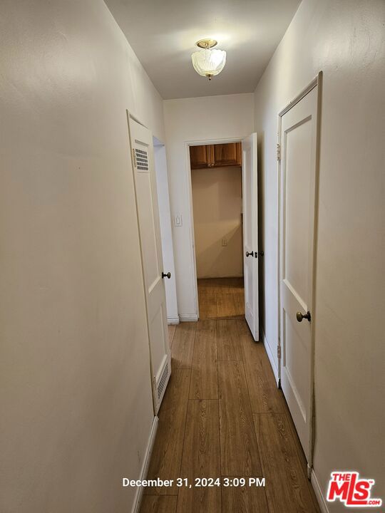 hallway featuring hardwood / wood-style flooring