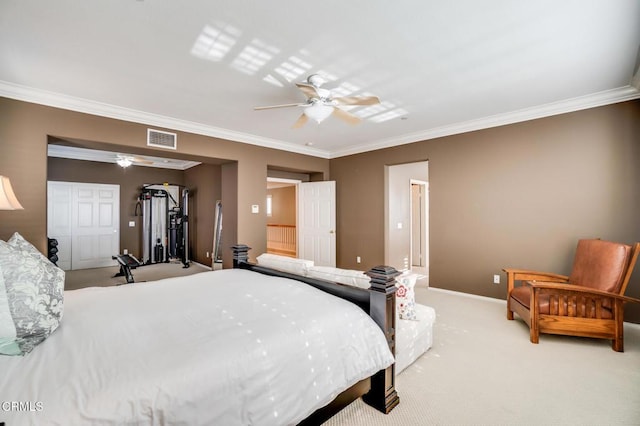 bedroom with ceiling fan, light colored carpet, a closet, and ornamental molding