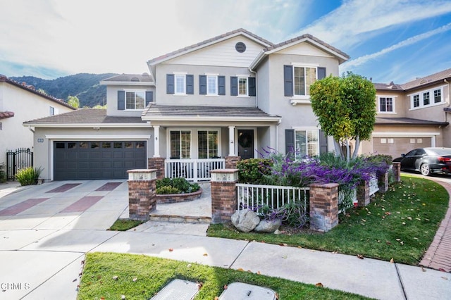 view of front of property featuring a mountain view and a porch