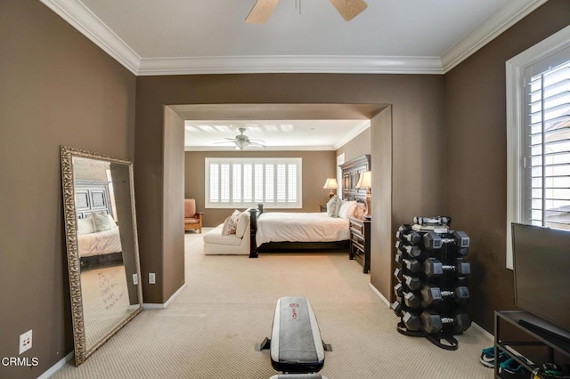 bedroom featuring ceiling fan, light colored carpet, and crown molding