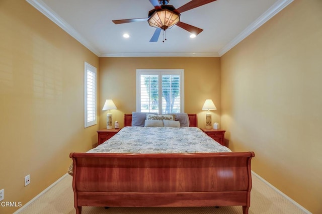 carpeted bedroom with ceiling fan and ornamental molding