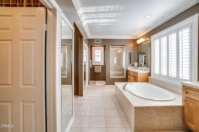 bathroom featuring crown molding, independent shower and bath, tile patterned floors, and vanity