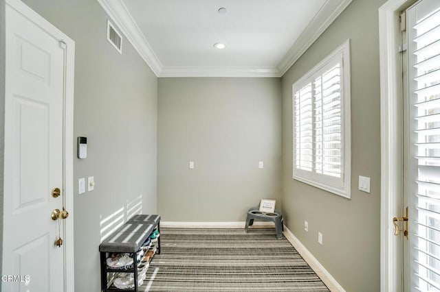 laundry room featuring carpet and ornamental molding