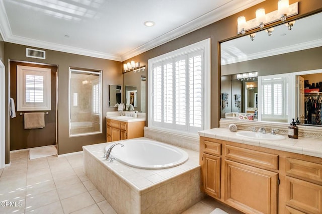 bathroom with vanity, tile patterned floors, a wealth of natural light, and ornamental molding