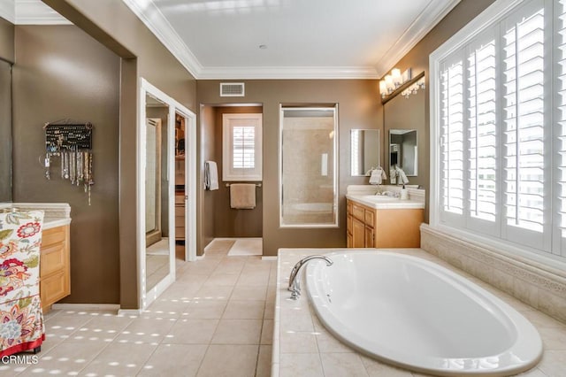 bathroom with vanity, ornamental molding, plenty of natural light, and tile patterned flooring