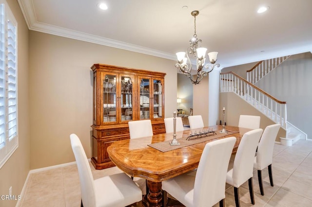 tiled dining space with crown molding and a chandelier