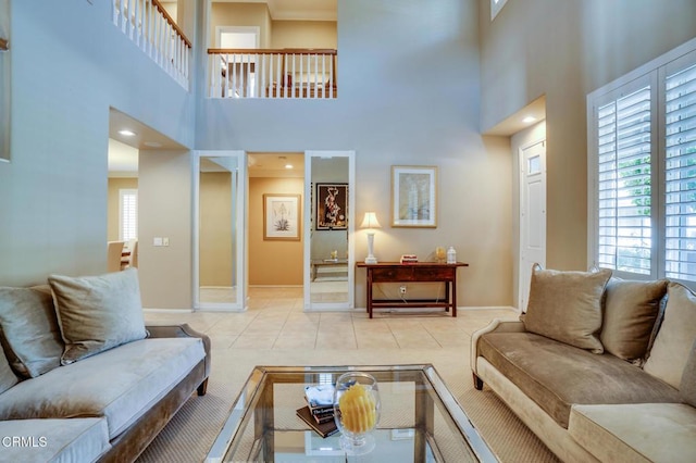 tiled living room with a high ceiling